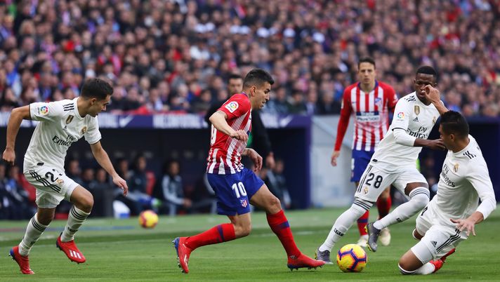 MADRID, SPAIN - FEBRUARY 09: Angel Correa of Atletico Madrid takes on Casemiro (14) and Vinicius Junior (28) and Sergio Reguilon of Real Madrid (23) during the La Liga match between Club Atletico de Madrid and Real Madrid CF at Wanda Metropolitano on February 09, 2019 in Madrid, Spain. (Photo by Gonzalo Arroyo Moreno/Getty Images) MADRID, SPAIN - FEBRUARY 09: Angel Correa of Atletico Madrid takes on Casemiro (14) and Vinicius Junior (28) and Sergio Reguilon of Real Madrid (23) during the La Liga match between Club Atletico de Madrid and Real Madrid CF at Wanda Metropolitano on February 09, 2019 in Madrid, Spain. (Photo by Gonzalo Arroyo Moreno/Getty Images)
