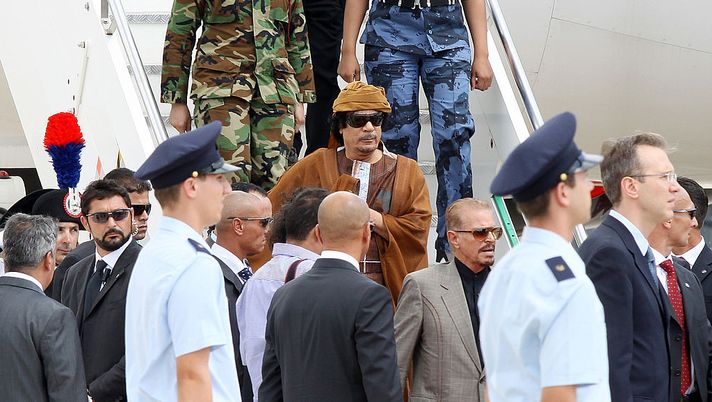 ROME - AUGUST 29: Libyan leader Muammar Gaddafi arrives at the Ciampino airport on August 29, 2010 in Rome, Italy. Gadaffi is on an official two-day visit to Italy for talks with Prime Minister Silvio Berlusconi. The visit also marks the second anniversary of a friendship treaty between Italy and Lybia. (Photo by Ernesto Ruscio/Getty Images) ROME - AUGUST 29: Libyan leader Muammar Gaddafi arrives at the Ciampino airport on August 29, 2010 in Rome, Italy. Gadaffi is on an official two-day visit to Italy for talks with Prime Minister Silvio Berlusconi. The visit also marks the second anniversary of a friendship treaty between Italy and Lybia. (Photo by Ernesto Ruscio/Getty Images)
