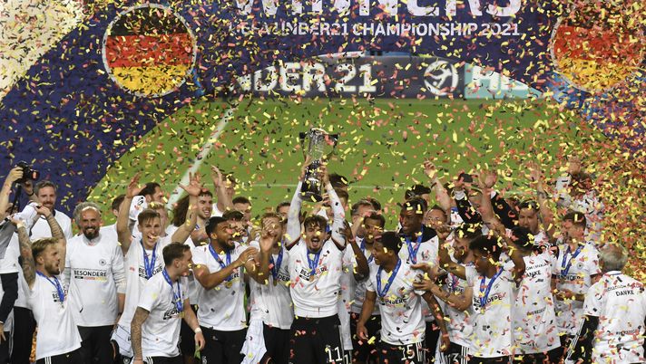 LJUBLJANA, SLOVENIA - JUNE 06: Mergim Berisha of Germany lifts the UEFA European Under-21 Championship trophy in celebration with team mates after winning the 2021 UEFA European Under-21 Championship Final match between Germany and Portugal at Stadion Stozice on June 06, 2021 in Ljubljana, Slovenia. (Photo by Jurij Kodrun/Getty Images) LJUBLJANA, SLOVENIA - JUNE 06: Mergim Berisha of Germany lifts the UEFA European Under-21 Championship trophy in celebration with team mates after winning the 2021 UEFA European Under-21 Championship Final match between Germany and Portugal at Stadion Stozice on June 06, 2021 in Ljubljana, Slovenia. (Photo by Jurij Kodrun/Getty Images)