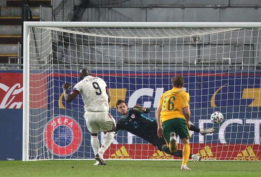 LEUVEN, BELGIUM - MARCH 24: Romelu Lukaku of Belgium scores their side's third goal from the penalty spot past Danny Ward of Wales during the FIFA World Cup 2022 Qatar qualifying match between Belgium and Wales on March 24, 2021 in Leuven, Belgium. Sporting stadiums around Belgium remain under strict restrictions due to the Coronavirus Pandemic as Government social distancing laws prohibit fans inside venues resulting in games being played behind closed doors. (Photo by Dean Mouhtaropoulos/Getty Images) LEUVEN, BELGIUM - MARCH 24: Romelu Lukaku of Belgium scores their side's third goal from the penalty spot past Danny Ward of Wales during the FIFA World Cup 2022 Qatar qualifying match between Belgium and Wales on March 24, 2021 in Leuven, Belgium. Sporting stadiums around Belgium remain under strict restrictions due to the Coronavirus Pandemic as Government social distancing laws prohibit fans inside venues resulting in games being played behind closed doors. (Photo by Dean Mouhtaropoulos/Getty Images)