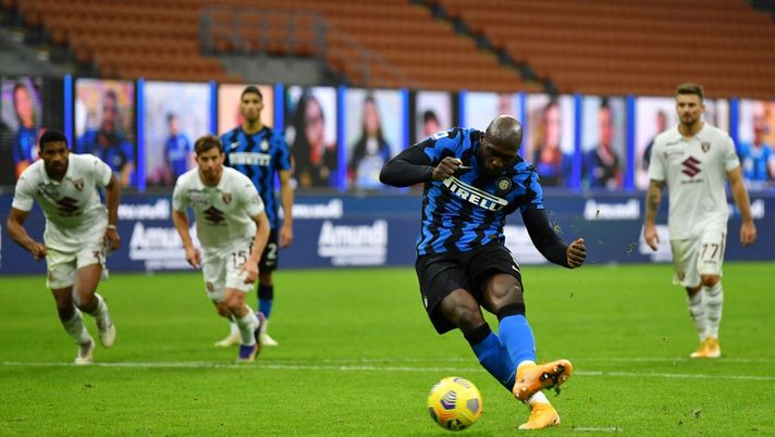 MILAN, ITALY - NOVEMBER 22: Romelu Lukaku of Inter Milan scores their sides third goal from the penalty spot during the Serie A match between FC Internazionale and Torino FC at Stadio Giuseppe Meazza on November 22, 2020 in Milan, Italy. Sporting stadiums around Italy remain under strict restrictions due to the Coronavirus Pandemic as Government social distancing laws prohibit fans inside venues resulting in games being played behind closed doors. (Photo by Valerio Pennicino/Getty Images) MILAN, ITALY - NOVEMBER 22: Romelu Lukaku of Inter Milan scores their sides third goal from the penalty spot during the Serie A match between FC Internazionale and Torino FC at Stadio Giuseppe Meazza on November 22, 2020 in Milan, Italy. Sporting stadiums around Italy remain under strict restrictions due to the Coronavirus Pandemic as Government social distancing laws prohibit fans inside venues resulting in games being played behind closed doors. (Photo by Valerio Pennicino/Getty Images)