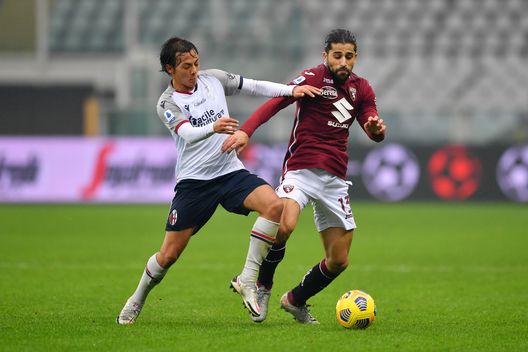 TURIN, ITALY - DECEMBER 20: Emanuel Vignato of Bologna battles for possession with Ricardo Rodríguez of Torino during the Serie A match between Torino FC and Bologna FC at Stadio Olimpico di Torino on December 20, 2020 in Turin, Italy. Sporting stadiums around Italy remain under strict restrictions due to the Coronavirus Pandemic as Government social distancing laws prohibit fans inside venues resulting in games being played behind closed doors. (Photo by Valerio Pennicino/Getty Images) TURIN, ITALY - DECEMBER 20: Emanuel Vignato of Bologna battles for possession with Ricardo Rodríguez of Torino during the Serie A match between Torino FC and Bologna FC at Stadio Olimpico di Torino on December 20, 2020 in Turin, Italy. Sporting stadiums around Italy remain under strict restrictions due to the Coronavirus Pandemic as Government social distancing laws prohibit fans inside venues resulting in games being played behind closed doors. (Photo by Valerio Pennicino/Getty Images)
