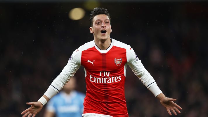 LONDON, ENGLAND - DECEMBER 10:  Mesut Ozil of Arsenal celebrates scoring his sides second goal during the Premier League match between Arsenal and Stoke City at the Emirates Stadium on December 10, 2016 in London, England.  (Photo by Julian Finney/Getty Images) 