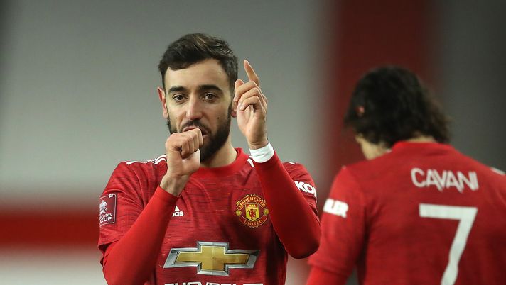 MANCHESTER, ENGLAND - JANUARY 24: Bruno Fernandes of Manchester United celebrates after scoring their sides third goal from a free kick during The Emirates FA Cup Fourth Round match between Manchester United and Liverpool at Old Trafford on January 24, 2021 in Manchester, England. Sporting stadiums around the UK remain under strict restrictions due to the Coronavirus Pandemic as Government social distancing laws prohibit fans inside venues resulting in games being played behind closed doors. (Photo by Martin Rickett - Pool/Getty Images) MANCHESTER, ENGLAND - JANUARY 24: Bruno Fernandes of Manchester United celebrates after scoring their sides third goal from a free kick during The Emirates FA Cup Fourth Round match between Manchester United and Liverpool at Old Trafford on January 24, 2021 in Manchester, England. Sporting stadiums around the UK remain under strict restrictions due to the Coronavirus Pandemic as Government social distancing laws prohibit fans inside venues resulting in games being played behind closed doors. (Photo by Martin Rickett - Pool/Getty Images)