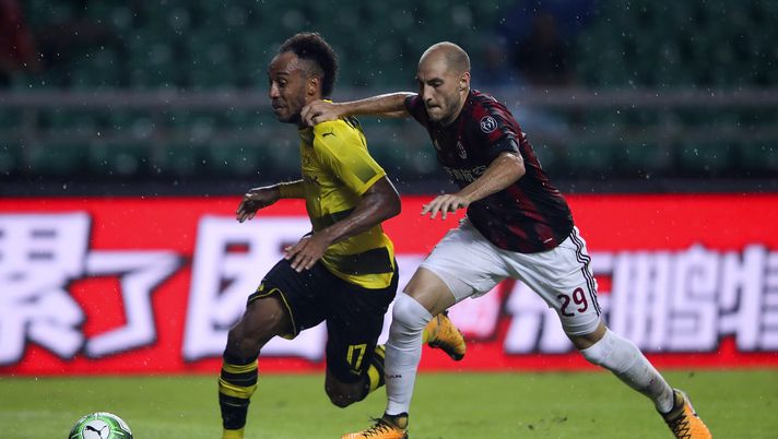 GUANGZHOU, CHINA - JULY 18: Pierre-Emerick Aubameyang of Borussia Dortmund competes for the ball with Gabriel Paletta of AC Milan during the 2017 International Champions Cup football match between AC milan and Borussia Dortmund at University Town Sports Centre Stadium on July 18, 2017 in Guangzhou, China. (Photo by Lintao Zhang/Getty Images) GUANGZHOU, CHINA - JULY 18: Pierre-Emerick Aubameyang of Borussia Dortmund competes for the ball with Gabriel Paletta of AC Milan during the 2017 International Champions Cup football match between AC milan and Borussia Dortmund at University Town Sports Centre Stadium on July 18, 2017 in Guangzhou, China. (Photo by Lintao Zhang/Getty Images)