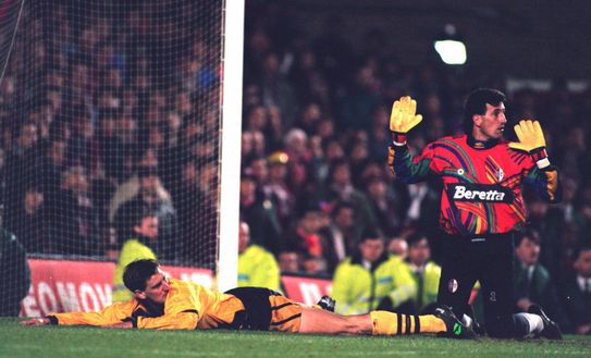 15 MAR 1994: TONY ADAMS OF ARSENAL SOCCER CLUB IS BROUGHT DOWN BY AN APOLOGETIC GIOVANNI GALLI, THE TORINO GOALKEEPER DURING THEIR EUROPEAN CUP WINNERS CUP MATCH Mandatory Credit: David Rogers/ALLSPORT 15 MAR 1994: TONY ADAMS OF ARSENAL SOCCER CLUB IS BROUGHT DOWN BY AN APOLOGETIC GIOVANNI GALLI, THE TORINO GOALKEEPER DURING THEIR EUROPEAN CUP WINNERS CUP MATCH Mandatory Credit: David Rogers/ALLSPORT