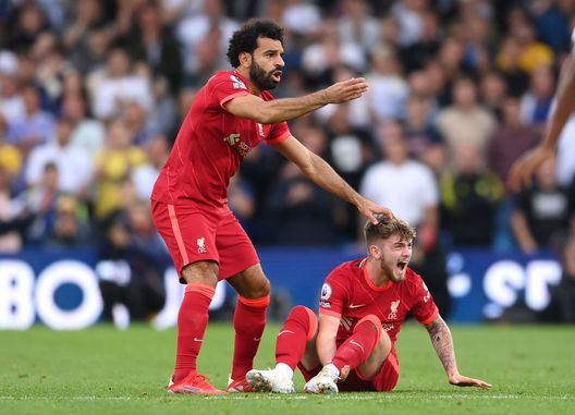 LEEDS, ENGLAND - SEPTEMBER 12: Harvey Elliott of Liverpool reacts as he looks to be injured as Mohamed Salah of Liverpool calls for medical attention during the Premier League match between Leeds United and Liverpool at Elland Road on September 12, 2021 in Leeds, England. (Photo by Laurence Griffiths/Getty Images) LEEDS, ENGLAND - SEPTEMBER 12: Harvey Elliott of Liverpool reacts as he looks to be injured as Mohamed Salah of Liverpool calls for medical attention during the Premier League match between Leeds United and Liverpool at Elland Road on September 12, 2021 in Leeds, England. (Photo by Laurence Griffiths/Getty Images)