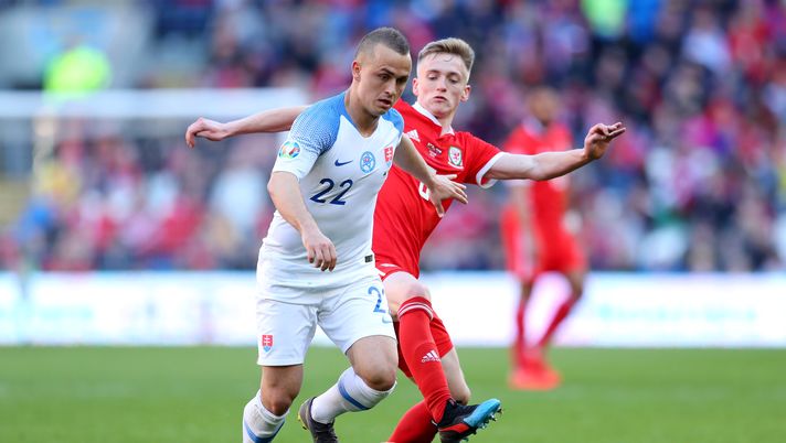 CARDIFF, WALES - MARCH 24: Stanislav Lobotka of Slovakia battles for possession with Matthew Smith of Wales during the 2020 UEFA European Championships group E qualifying match between Wales and Slovakia at Cardiff City Stadium on March 24, 2019 in Cardiff, United Kingdom. (Photo by Catherine Ivill/Getty Images) CARDIFF, WALES - MARCH 24: Stanislav Lobotka of Slovakia battles for possession with Matthew Smith of Wales during the 2020 UEFA European Championships group E qualifying match between Wales and Slovakia at Cardiff City Stadium on March 24, 2019 in Cardiff, United Kingdom. (Photo by Catherine Ivill/Getty Images)