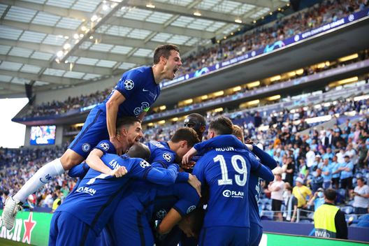 PORTO, PORTUGAL - MAY 29: Kai Havertz of Chelsea (hidden) celebrates with team mates after scoring their side's first goal during the UEFA Champions League Final between Manchester City and Chelsea FC at Estadio do Dragao on May 29, 2021 in Porto, Portugal. (Photo by Jose Coelho - Pool/Getty Images) Champions League