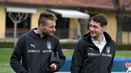 FLORENCE, ITALY - MARCH 20:  Ciro Immobile (L) and Andrea Belotti of Italy chat prior to the Italy training session at Centro Tecnico Federale di Coverciano on March 20, 2018 in Florence, Italy.  (Photo by Claudio Villa/Getty Images)
