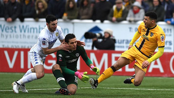 SUTTON, GREATER LONDON - JANUARY 29: Marco Silvestri of Leeds United (C) fouls Maxime Biamou of Sutton United (R) leading to the penalty during The Emirates FA Cup Fourth Round match between Sutton United and Leeds United at Borough Sports Ground on January 29, 2017 in Sutton, Greater London. (Photo by Mike Hewitt/Getty Images) SUTTON, GREATER LONDON - JANUARY 29: Marco Silvestri of Leeds United (C) fouls Maxime Biamou of Sutton United (R) leading to the penalty during The Emirates FA Cup Fourth Round match between Sutton United and Leeds United at Borough Sports Ground on January 29, 2017 in Sutton, Greater London. (Photo by Mike Hewitt/Getty Images)