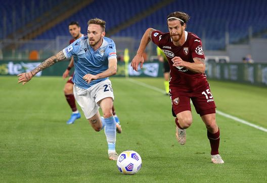 ROME, ITALY - MAY 18: Cristian Ansaldi of Torino FC battles for possession with Manuel Lazzari of S.S. Lazio during the Serie A match between SS Lazio and Torino FC at Stadio Olimpico on May 18, 2021 in Rome, Italy. Sporting stadiums around Italy remain under strict restrictions due to the Coronavirus Pandemic as Government social distancing laws prohibit fans inside venues resulting in games being played behind closed doors. (Photo by Paolo Bruno/Getty Images) ROME, ITALY - MAY 18: Cristian Ansaldi of Torino FC battles for possession with Manuel Lazzari of S.S. Lazio during the Serie A match between SS Lazio and Torino FC at Stadio Olimpico on May 18, 2021 in Rome, Italy. Sporting stadiums around Italy remain under strict restrictions due to the Coronavirus Pandemic as Government social distancing laws prohibit fans inside venues resulting in games being played behind closed doors. (Photo by Paolo Bruno/Getty Images)