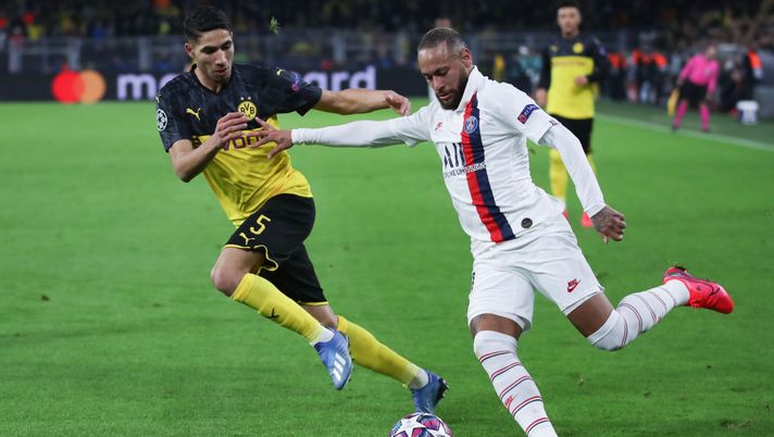 DORTMUND, GERMANY - FEBRUARY 18: Neymar of Paris Saint-Germain is challenged by Achraf Hakimi of Dortmund during the UEFA Champions League round of 16 first leg match between Borussia Dortmund and Paris Saint-Germain at Signal Iduna Park on February 18, 2020 in Dortmund, Germany. (Photo by Alex Grimm/Getty Images) DORTMUND, GERMANY - FEBRUARY 18: Neymar of Paris Saint-Germain is challenged by Achraf Hakimi of Dortmund during the UEFA Champions League round of 16 first leg match between Borussia Dortmund and Paris Saint-Germain at Signal Iduna Park on February 18, 2020 in Dortmund, Germany. (Photo by Alex Grimm/Getty Images)