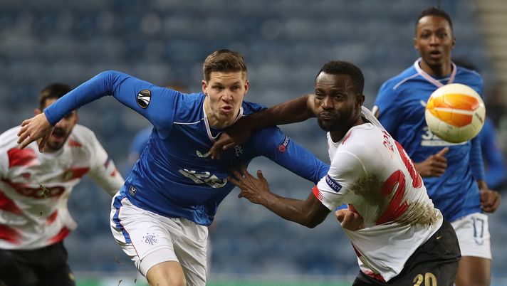 GLASGOW, SCOTLAND - DECEMBER 03: Cedric Itten of Rangers is challenged by Merveille Bokadi of Standard Liege during the UEFA Europa League Group D stage match between Rangers and Standard Liege at Ibrox Stadium on December 03, 2020 in Glasgow, Scotland. Sporting stadiums around the UK remain under strict restrictions due to the Coronavirus Pandemic as Government social distancing laws prohibit fans inside venues resulting in games being played behind closed doors. (Photo by Ian MacNicol/Getty Images) GLASGOW, SCOTLAND - DECEMBER 03: Cedric Itten of Rangers is challenged by Merveille Bokadi of Standard Liege during the UEFA Europa League Group D stage match between Rangers and Standard Liege at Ibrox Stadium on December 03, 2020 in Glasgow, Scotland. Sporting stadiums around the UK remain under strict restrictions due to the Coronavirus Pandemic as Government social distancing laws prohibit fans inside venues resulting in games being played behind closed doors. (Photo by Ian MacNicol/Getty Images)