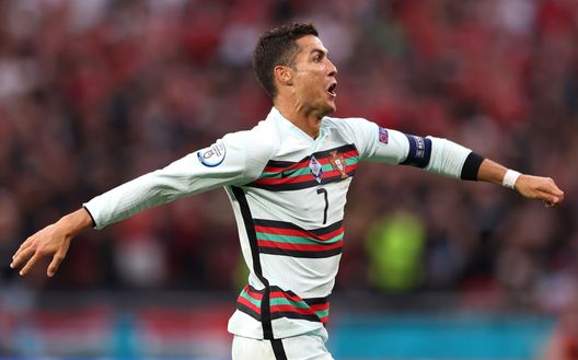 BUDAPEST, HUNGARY - JUNE 15: Cristiano Ronaldo of Portugal celebrates after scoring their side's third goal during the UEFA Euro 2020 Championship Group F match between Hungary and Portugal at Puskas Arena on June 15, 2021 in Budapest, Hungary. (Photo by Alex Pantling/Getty Images) BUDAPEST, HUNGARY - JUNE 15: Cristiano Ronaldo of Portugal celebrates after scoring their side's third goal during the UEFA Euro 2020 Championship Group F match between Hungary and Portugal at Puskas Arena on June 15, 2021 in Budapest, Hungary. (Photo by Alex Pantling/Getty Images)