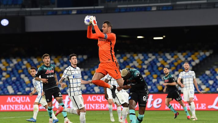 NAPLES, ITALY - APRIL 18: Samir Handanovic of FC Internazionale claims the ball under pressure from Victor Osimhen of Napoli during the Serie A match between SSC Napoli and FC Internazionale at Stadio Diego Armando Maradona on April 18, 2021 in Naples, Italy. Sporting stadiums around Italy remain under strict restrictions due to the Coronavirus Pandemic as Government social distancing laws prohibit fans inside venues resulting in games being played behind closed doors. (Photo by Francesco Pecoraro/Getty Images) NAPLES, ITALY - APRIL 18: Samir Handanovic of FC Internazionale claims the ball under pressure from Victor Osimhen of Napoli during the Serie A match between SSC Napoli and FC Internazionale at Stadio Diego Armando Maradona on April 18, 2021 in Naples, Italy. Sporting stadiums around Italy remain under strict restrictions due to the Coronavirus Pandemic as Government social distancing laws prohibit fans inside venues resulting in games being played behind closed doors. (Photo by Francesco Pecoraro/Getty Images)