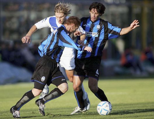 BERGAMO, ITALY - NOVEMBER 14: Michele Marcolini and Demetrio Albertini of Atalanta take on a Brescia Player during the Serie A match between Atalanta and Brescia on November 14, 2004 in Bergamo, Italy. (Photo by New Press/Getty Images) BERGAMO, ITALY - NOVEMBER 14: Michele Marcolini and Demetrio Albertini of Atalanta take on a Brescia Player during the Serie A match between Atalanta and Brescia on November 14, 2004 in Bergamo, Italy. (Photo by New Press/Getty Images)