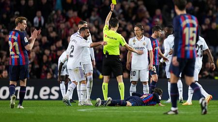 BARCELONA, SPAIN - MARCH 19: Luka Modric of Real Madrid is shown a yellow card by Referee De Burgos Bengoetxea during the LaLiga Santander match between FC Barcelona and Real Madrid CF at Spotify Camp Nou on March 19, 2023 in Barcelona, Spain. (Photo by Angel Martinez/Getty Images)