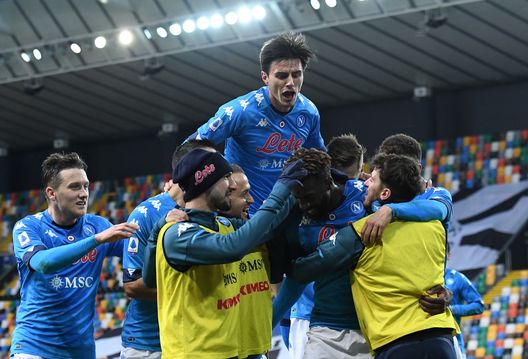 UDINE, ITALY - JANUARY 10: Tiemoue Bakayoko of SSC Napoli celebrates with team mates after scoring their side's second goal as Eljif Elmas jumps on top during the Serie A match between Udinese Calcio and SSC Napoli at Dacia Arena on January 10, 2021 in Udine, Italy. Sporting stadiums around Italy remain under strict restrictions due to the Coronavirus Pandemic as Government social distancing laws prohibit fans inside venues resulting in games being played behind closed doors. (Photo by Alessandro Sabattini/Getty Images) UDINE, ITALY - JANUARY 10: Tiemoue Bakayoko of SSC Napoli celebrates with team mates after scoring their side's second goal as Eljif Elmas jumps on top during the Serie A match between Udinese Calcio and SSC Napoli at Dacia Arena on January 10, 2021 in Udine, Italy. Sporting stadiums around Italy remain under strict restrictions due to the Coronavirus Pandemic as Government social distancing laws prohibit fans inside venues resulting in games being played behind closed doors. (Photo by Alessandro Sabattini/Getty Images)