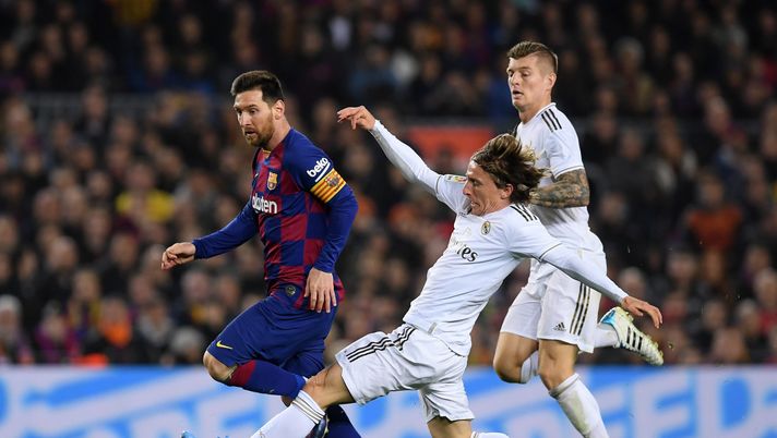 BARCELONA, SPAIN - DECEMBER 18: Lionel Messi of Barcelona is tackled by Luka Modric of Real Madrid during the Liga match between FC Barcelona and Real Madrid CF at Camp Nou on December 18, 2019 in Barcelona, Spain. (Photo by Alex Caparros/Getty Images) BARCELONA, SPAIN - DECEMBER 18: Lionel Messi of Barcelona is tackled by Luka Modric of Real Madrid during the Liga match between FC Barcelona and Real Madrid CF at Camp Nou on December 18, 2019 in Barcelona, Spain. (Photo by Alex Caparros/Getty Images)