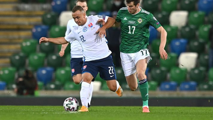 BELFAST, NORTHERN IRELAND - NOVEMBER 12: Stanislav Lobotka of Slovakia is tackled by Paddy McNair of Northern Ireland during the UEFA EURO 2020 Play-Off Final between Northern Ireland and Slovakia at Windsor Park on November 12, 2020 in Belfast, Northern Ireland. Northern Ireland are allowing a limited number of spectators 1060 to be in attendance as Covid-19 pandemic restrictions are eased. (Photo by Charles McQuillan/Getty Images) BELFAST, NORTHERN IRELAND - NOVEMBER 12: Stanislav Lobotka of Slovakia is tackled by Paddy McNair of Northern Ireland during the UEFA EURO 2020 Play-Off Final between Northern Ireland and Slovakia at Windsor Park on November 12, 2020 in Belfast, Northern Ireland. Northern Ireland are allowing a limited number of spectators 1060 to be in attendance as Covid-19 pandemic restrictions are eased. (Photo by Charles McQuillan/Getty Images)