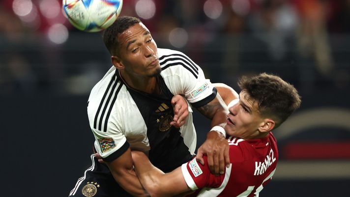 LEIPZIG, GERMANY - SEPTEMBER 23: Lukas Nmecha of Germany battles for the ball with Milos Kerkez of Hungary during the UEFA Nations League League A Group 3 match between Germany and Hungary at Red Bull Arena on September 23, 2022 in Leipzig, Germany. (Photo by Alexander Hassenstein/Getty Images) Kerkez