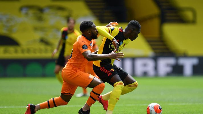 WATFORD, ENGLAND - JULY 11: Ismaila Sarr of Watford is challenged by Danny Rose of Newcastle United during the Premier League match between Watford FC and Newcastle United at Vicarage Road on July 11, 2020 in Watford, England. Football Stadiums around Europe remain empty due to the Coronavirus Pandemic as Government social distancing laws prohibit fans inside venues resulting in all fixtures being played behind closed doors. (Photo by Justin Setterfield/Getty Images) WATFORD, ENGLAND - JULY 11: Ismaila Sarr of Watford is challenged by Danny Rose of Newcastle United during the Premier League match between Watford FC and Newcastle United at Vicarage Road on July 11, 2020 in Watford, England. Football Stadiums around Europe remain empty due to the Coronavirus Pandemic as Government social distancing laws prohibit fans inside venues resulting in all fixtures being played behind closed doors. (Photo by Justin Setterfield/Getty Images)