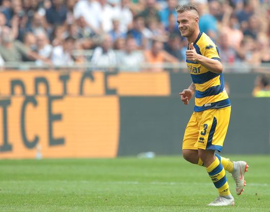  MILAN, ITALY - SEPTEMBER 15: Federico Dimarco of Parma Calcio celebrates after scoring the opening goal during the serie A match between FC Internazionale and Parma Calcio at Stadio Giuseppe Meazza on September 15, 2018 in Milan, Italy. (Photo by Emilio Andreoli/Getty Images) 