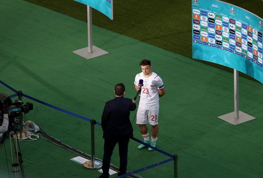 BAKU, AZERBAIJAN - JUNE 12: Xherdan Shaqiri of Switzerland is interviewed following the UEFA Euro 2020 Championship Group A match between Wales and Switzerland at the Baku Olympic Stadium on June 12, 2021 in Baku, Azerbaijan. (Photo by Naomi Baker/Getty Images) BAKU, AZERBAIJAN - JUNE 12: Xherdan Shaqiri of Switzerland is interviewed following the UEFA Euro 2020 Championship Group A match between Wales and Switzerland at the Baku Olympic Stadium on June 12, 2021 in Baku, Azerbaijan. (Photo by Naomi Baker/Getty Images)