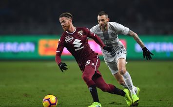  TURIN, ITALY - JANUARY 27: Cristian Ansaldi (L) of Torino FC in action against Marcelo Brozovic of FC Internazionale during the Serie A match between Torino FC and FC Internazionale at Stadio Olimpico di Torino on January 27, 2019 in Turin, Italy. (Photo by Valerio Pennicino/Getty Images)