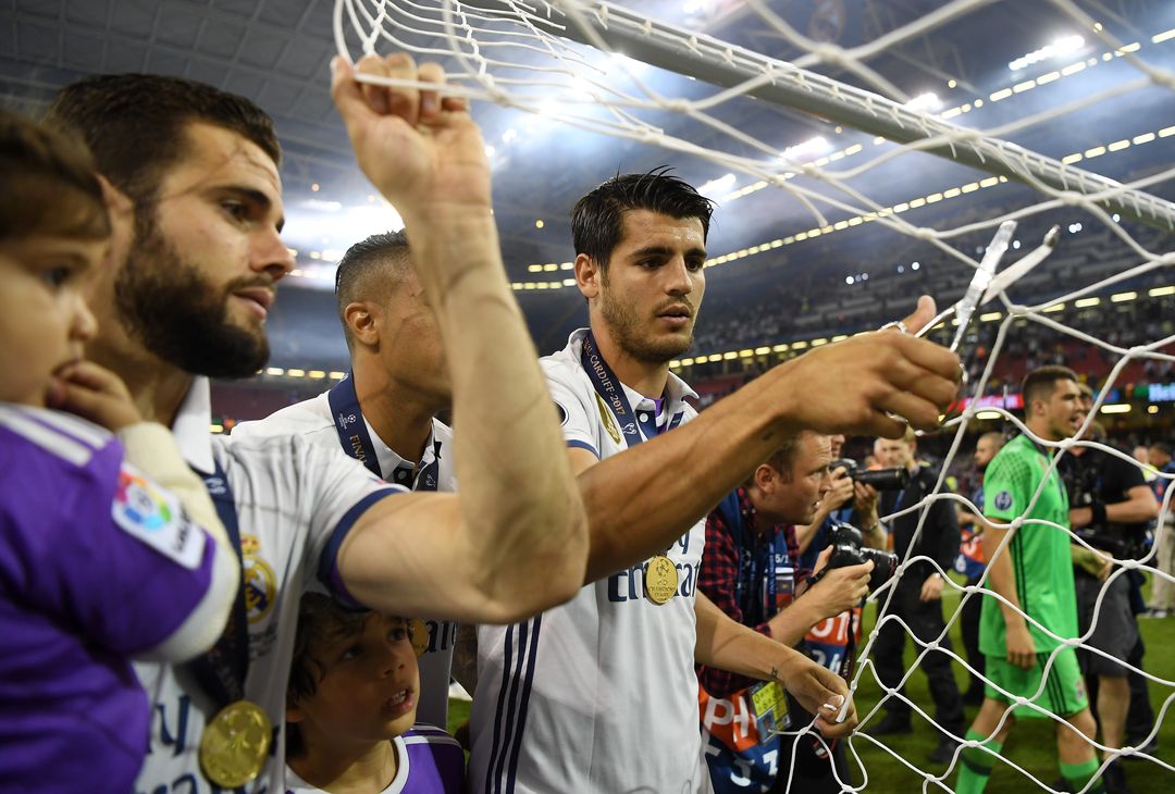  CARDIFF, WALES - JUNE 03:  Alvaro Morata of Real Madrid cuts the net after the UEFA Champions League Final between Juventus and Real Madrid at National Stadium of Wales on June 3, 2017 in Cardiff, Wales.  (Photo by Shaun Botterill/Getty Images) 