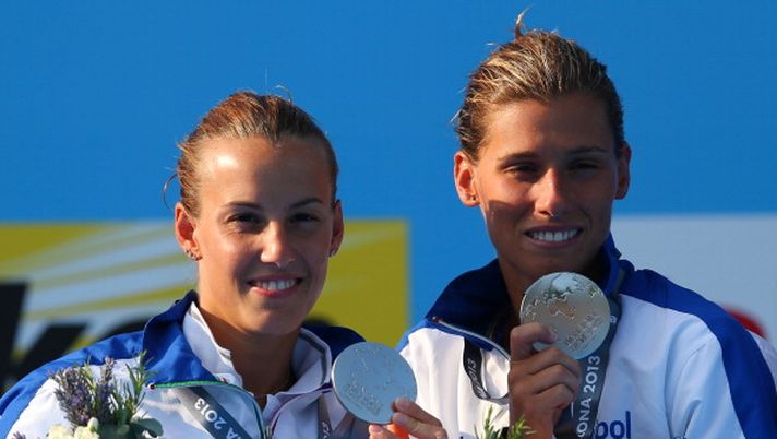 BARCELONA, SPAIN - JULY 20: Silver medallists Tania Cagnotto and Francesca Dallape pose with their medals and the offical mascot XOP after the Women's 3m Springboard Synchronised Diving final on day one of the 15th FINA World Championships at Piscina Municipal de Montjuic on July 20, 2013 in Barcelona, Spain. (Photo by Clive Rose/Getty Images) BARCELONA, SPAIN - JULY 20: Silver medallists Tania Cagnotto and Francesca Dallape pose with their medals and the offical mascot XOP after the Women's 3m Springboard Synchronised Diving final on day one of the 15th FINA World Championships at Piscina Municipal de Montjuic on July 20, 2013 in Barcelona, Spain. (Photo by Clive Rose/Getty Images)
