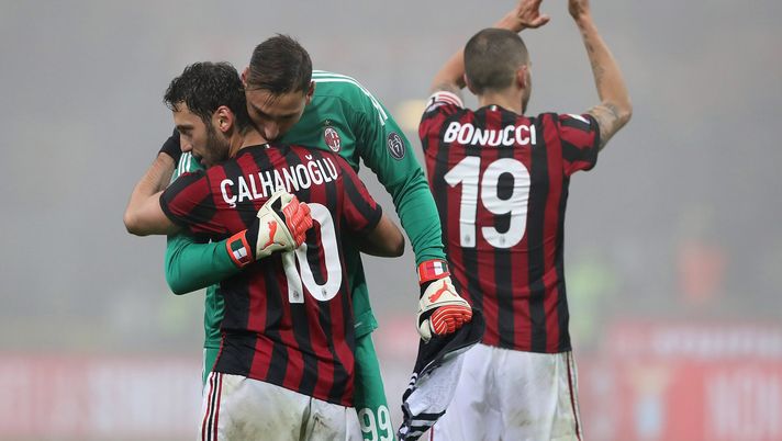 MILAN, ITALY - JANUARY 28: Gianluigi Donnarumma of AC Milan embraces Hakan Calhanoglu #10 at the end of the serie A match between AC Milan and SS Lazio at Stadio Giuseppe Meazza on January 28, 2018 in Milan, Italy. (Photo by Marco Luzzani/Getty Images) MILAN, ITALY - JANUARY 28: Gianluigi Donnarumma of AC Milan embraces Hakan Calhanoglu #10 at the end of the serie A match between AC Milan and SS Lazio at Stadio Giuseppe Meazza on January 28, 2018 in Milan, Italy. (Photo by Marco Luzzani/Getty Images)