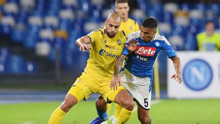NAPLES, ITALY - OCTOBER 19: Sofyan Amrabat of Hellas Verona vies with Allan of SSC Napoli during the Serie A match between SSC Napoli and Hellas Verona at Stadio San Paolo on October 19, 2019 in Naples, Italy. (Photo by Francesco Pecoraro/Getty Images) NAPLES, ITALY - OCTOBER 19: Sofyan Amrabat of Hellas Verona vies with Allan of SSC Napoli during the Serie A match between SSC Napoli and Hellas Verona at Stadio San Paolo on October 19, 2019 in Naples, Italy. (Photo by Francesco Pecoraro/Getty Images)
