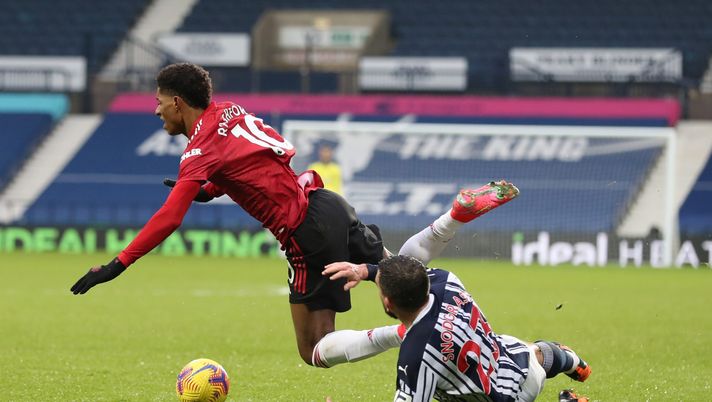 WEST BROMWICH, ENGLAND - FEBRUARY 14: Marcus Rashford of Manchester United is tackled by Robert Snodgrass of West Bromwich Albion resulting in a yellow card for Robert Snodgrass during the Premier League match between West Bromwich Albion and Manchester United at The Hawthorns on February 14, 2021 in West Bromwich, England. Sporting stadiums around the UK remain under strict restrictions due to the Coronavirus Pandemic as Government social distancing laws prohibit fans inside venues resulting in games being played behind closed doors. (Photo by Naomi Baker/Getty Images) WEST BROMWICH, ENGLAND - FEBRUARY 14: Marcus Rashford of Manchester United is tackled by Robert Snodgrass of West Bromwich Albion resulting in a yellow card for Robert Snodgrass during the Premier League match between West Bromwich Albion and Manchester United at The Hawthorns on February 14, 2021 in West Bromwich, England. Sporting stadiums around the UK remain under strict restrictions due to the Coronavirus Pandemic as Government social distancing laws prohibit fans inside venues resulting in games being played behind closed doors. (Photo by Naomi Baker/Getty Images)