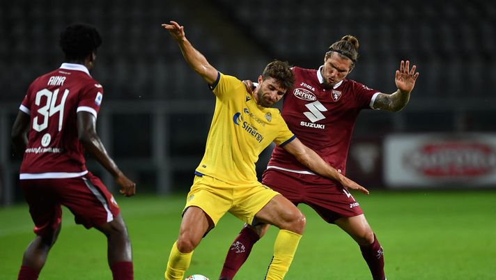 TURIN, ITALY - JULY 22:  Vojnovic Lyanco (R) of Torino FC competes with Fabio Borini of Hellas Verona during the Serie A match between Torino FC and  Hellas Verona at Stadio Olimpico di Torino on July 22, 2020 in Turin, Italy.  (Photo by Valerio Pennicino/Getty Images) 