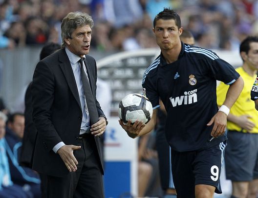 MALAGA, SPAIN - MAY 16: Head coach Manuel Pellegrini (L) gives instructions to Cristiano Ronaldo during the La Liga match between Malaga and Real Madrid at La Rosaleda Stadium on May 16, 2010 in Malaga, Spain. (Photo by Angel Martinez/Getty Images) MALAGA, SPAIN - MAY 16: Head coach Manuel Pellegrini (L) gives instructions to Cristiano Ronaldo during the La Liga match between Malaga and Real Madrid at La Rosaleda Stadium on May 16, 2010 in Malaga, Spain. (Photo by Angel Martinez/Getty Images)