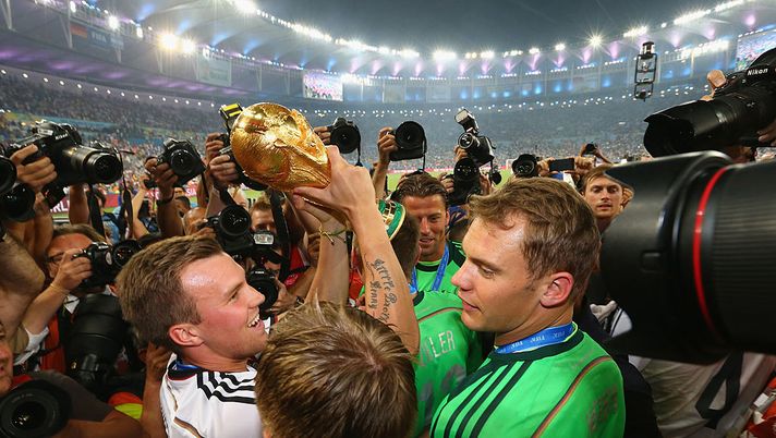 RIO DE JANEIRO, BRAZIL - JULY 13: Kevin Grosskreutz of Germany raises the World Cup trophy with teammates after defeating Argentina 1-0 in extra time during the 2014 FIFA World Cup Brazil Final match between Germany and Argentina at Maracana on July 13, 2014 in Rio de Janeiro, Brazil. (Photo by Martin Rose/Getty Images) RIO DE JANEIRO, BRAZIL - JULY 13: Kevin Grosskreutz of Germany raises the World Cup trophy with teammates after defeating Argentina 1-0 in extra time during the 2014 FIFA World Cup Brazil Final match between Germany and Argentina at Maracana on July 13, 2014 in Rio de Janeiro, Brazil. (Photo by Martin Rose/Getty Images)
