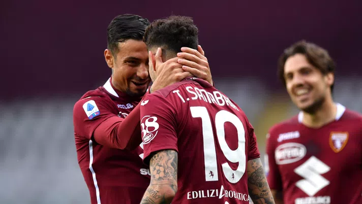 TURIN, ITALY - APRIL 03: Antonio Sanabria of Torino F.C. celebrates with teammate Armando Izzo after scoring their team's second goal during the Serie A match between Torino FC and Juventus at Stadio Olimpico di Torino on April 03, 2021 in Turin, Italy. Sporting stadiums around Italy remain under strict restrictions due to the Coronavirus Pandemic as Government social distancing laws prohibit fans inside venues resulting in games being played behind closed doors. (Photo by Valerio Pennicino/Getty Images)