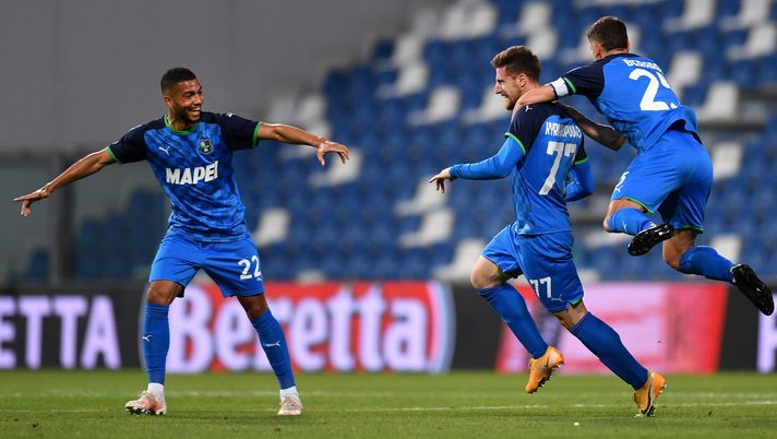 REGGIO NELL'EMILIA, ITALY - MAY 23: Georgios Kyriakopoulos of U.S. Sassuolo Calcio celebrates with team mates Jeremy Toljan and Domenico Berardi after scoring his team's first goal during the Serie A match between US Sassuolo and SS Lazio at Mapei Stadium - Citta' del Tricolore on May 23, 2021 in Reggio nell'Emilia, Italy. Sporting stadiums around Italy remain under strict restrictions due to the Coronavirus Pandemic as Government social distancing laws prohibit fans inside venues resulting in games being played behind closed doors. (Photo by Alessandro Sabattini/Getty Images) REGGIO NELL'EMILIA, ITALY - MAY 23: Georgios Kyriakopoulos of U.S. Sassuolo Calcio celebrates with team mates Jeremy Toljan and Domenico Berardi after scoring his team's first goal during the Serie A match between US Sassuolo and SS Lazio at Mapei Stadium - Citta' del Tricolore on May 23, 2021 in Reggio nell'Emilia, Italy. Sporting stadiums around Italy remain under strict restrictions due to the Coronavirus Pandemic as Government social distancing laws prohibit fans inside venues resulting in games being played behind closed doors. (Photo by Alessandro Sabattini/Getty Images)