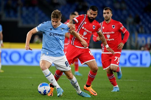 ROME, ITALY - MAY 07: Toma Basic of SS Lazio compete for the ball with Tomas Rincon of UC Sampdoria during the Serie A match between SS Lazio and UC Sampdoria at Stadio Olimpico on May 07, 2022 in Rome, Italy. (Photo by Marco Rosi - SS Lazio/Getty Images)