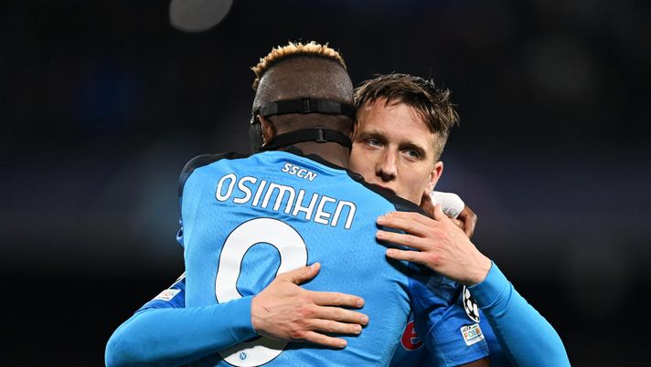 NAPLES, ITALY - MARCH 15: Piotr Zielinski of SSC Napoli celebrates with Victor Osimhen after scoring the team's third goal during the UEFA Champions League round of 16 leg two match between SSC Napoli and Eintracht Frankfurt at Stadio Diego Armando Maradona on March 15, 2023 in Naples, Italy. (Photo by Francesco Pecoraro/Getty Images) napoli