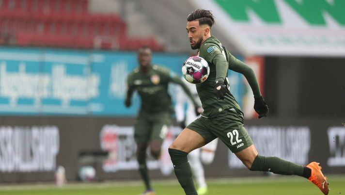 AUGSBURG, GERMANY - JANUARY 10: Nicolas Gonzalez of Stuttgart runs with the ball  during the Bundesliga match between FC Augsburg and VfB Stuttgart at WWK-Arena on January 10, 2021 in Augsburg, Germany. Sporting stadiums around Germany remain under strict restrictions due to the Coronavirus Pandemic as Government social distancing laws prohibit fans inside venues resulting in games being played behind closed doors. (Photo by Alexander Hassenstein/Getty Images) 