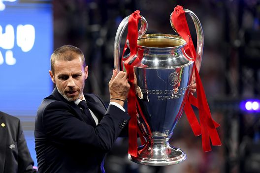 MADRID, SPAIN - JUNE 01: Aleksander Ceferin UEFA president picks up the Champions league trophy in preparation to presenting it to Liverpool during the UEFA Champions League Final between Tottenham Hotspur and Liverpool at Estadio Wanda Metropolitano on June 01, 2019 in Madrid, Spain. (Photo by Matthias Hangst/Getty Images) MADRID, SPAIN - JUNE 01: Aleksander Ceferin UEFA president picks up the Champions league trophy in preparation to presenting it to Liverpool during the UEFA Champions League Final between Tottenham Hotspur and Liverpool at Estadio Wanda Metropolitano on June 01, 2019 in Madrid, Spain. (Photo by Matthias Hangst/Getty Images)