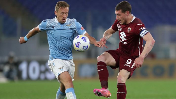 ROME, ITALY - MAY 18: Lucas Leiva of S.S. Lazio battles for possession with Andrea Belotti of Torino FC during the Serie A match between SS Lazio and Torino FC at Stadio Olimpico on May 18, 2021 in Rome, Italy. Sporting stadiums around Italy remain under strict restrictions due to the Coronavirus Pandemic as Government social distancing laws prohibit fans inside venues resulting in games being played behind closed doors. (Photo by Paolo Bruno/Getty Images) ROME, ITALY - MAY 18: Lucas Leiva of S.S. Lazio battles for possession with Andrea Belotti of Torino FC during the Serie A match between SS Lazio and Torino FC at Stadio Olimpico on May 18, 2021 in Rome, Italy. Sporting stadiums around Italy remain under strict restrictions due to the Coronavirus Pandemic as Government social distancing laws prohibit fans inside venues resulting in games being played behind closed doors. (Photo by Paolo Bruno/Getty Images)