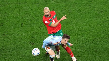 AL RAYYAN, QATAR - DECEMBER 06: Gavi of Spain battles for possession with Sofyan Amrabat of Morocco during the FIFA World Cup Qatar 2022 Round of 16 match between Morocco and Spain at Education City Stadium on December 06, 2022 in Al Rayyan, Qatar. (Photo by Alex Grimm/Getty Images)