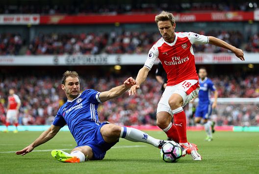 LONDON, ENGLAND - SEPTEMBER 24:  Branislav Ivanovic of Chelsea (L) tackles Nacho Monreal of Arsenal (R) during the Premier League match between Arsenal and Chelsea at the Emirates Stadium on September 24, 2016 in London, England.  (Photo by Paul Gilham/Getty Images) 