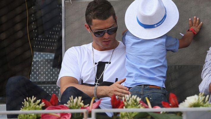 MADRID, SPAIN - MAY 08: Real Madrid footballer Cristiano Ronaldo and his son Cristiano Ronaldo Junior watch Rafael Nadal of Spain against Jarkko Nieminen of Finland in their third round match during day six of the Mutua Madrid Open tennis tournament at the Caja Magica on May 8, 2014 in Madrid, Spain. (Photo by Clive Brunskill/Getty Images) MADRID, SPAIN - MAY 08: Real Madrid footballer Cristiano Ronaldo and his son Cristiano Ronaldo Junior watch Rafael Nadal of Spain against Jarkko Nieminen of Finland in their third round match during day six of the Mutua Madrid Open tennis tournament at the Caja Magica on May 8, 2014 in Madrid, Spain. (Photo by Clive Brunskill/Getty Images)