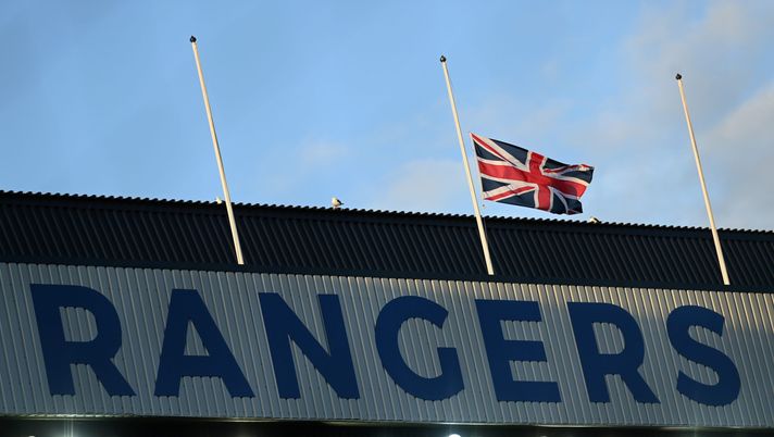 GLASGOW, SCOTLAND - SEPTEMBER 14: A general view inside the stadium as the Union Jack flag is seen at half mast to pay tribute to Her Majesty Queen Elizabeth II, who died away at Balmoral Castle on September 8 prior to the UEFA Champions League group A match between Rangers FC and SSC Napoli at Ibrox Stadium on September 14, 2022 in Glasgow, Scotland. (Photo by Stu Forster/Getty Images) ibrox park