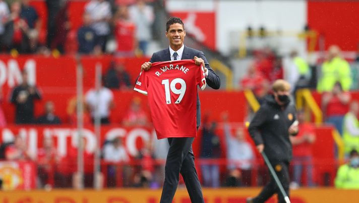 MANCHESTER, ENGLAND - AUGUST 14: New signing, Raphael Varane of Manchester United is introduced to fans on the pitch prior to the Premier League match between Manchester United  and  Leeds United at Old Trafford on August 14, 2021 in Manchester, England. (Photo by Catherine Ivill/Getty Images,) 